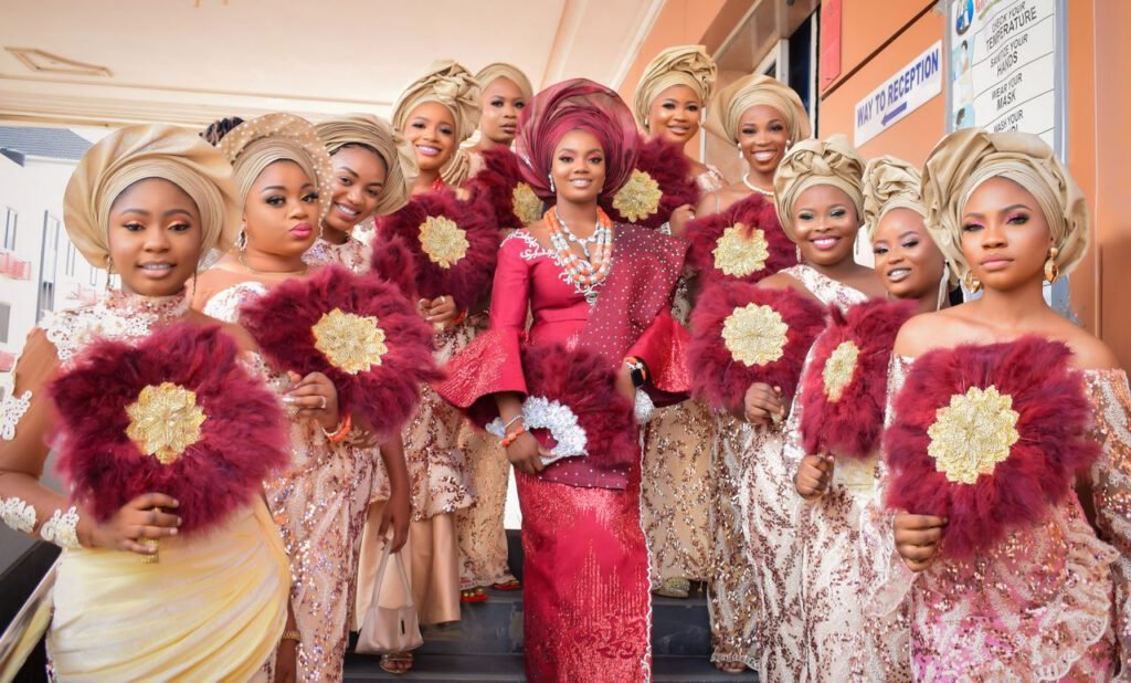 pexels photo 20367616 A vibrant group of women in traditional African attire at a joyous wedding celebration.