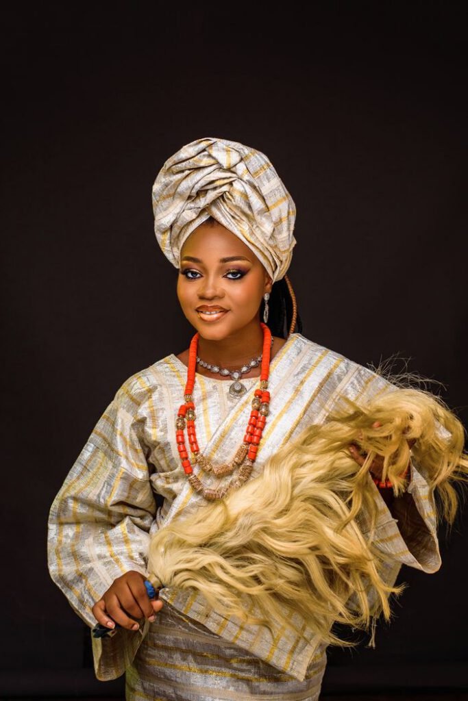 Portrait of a beautiful African bride in traditional attire with intricate accessories, showcasing cultural elegance.