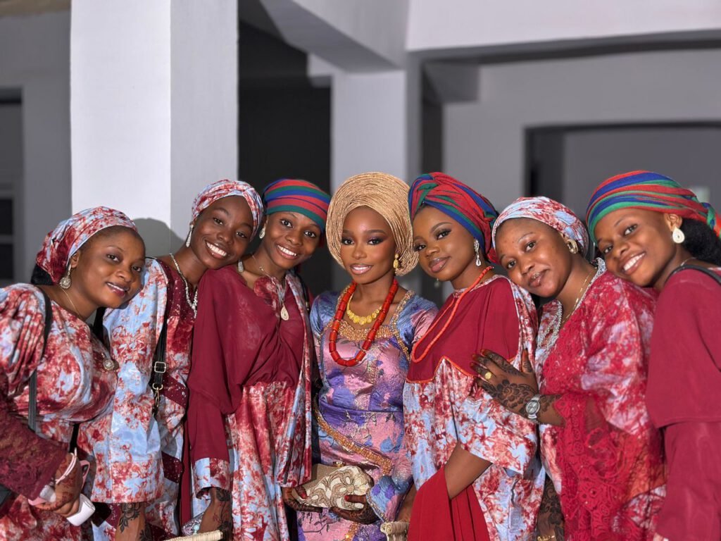 pexels photo 35117349 Group photo of Nigerian women in vibrant traditional attire at a wedding.